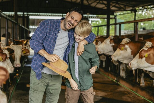 Father and Son Bonding at Organic Cattle Farm